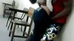 Young India College girl kissing in classroom