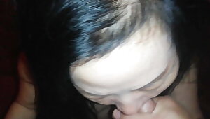 Asian prostitute sucks and swallows cum for money