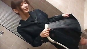 Girl in black serafuku wets her clothes