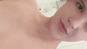 Young chick show her small tits and sexy body