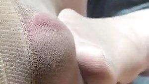 Couple footjob in tan pantyhose