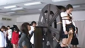 japanese schoolgirls punished on waterwheel